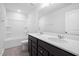 A bathroom featuring a double sink vanity, a large mirror, and a shower-tub combo at 721 Denburn Pl, Raleigh, NC 27603