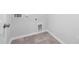A laundry room featuring tile floors and access for easy connections at 721 Denburn Pl, Raleigh, NC 27603
