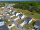Aerial view of a well-maintained neighborhood, with modern homes, manicured lawns, and convenient street access at 80 Spotted Bee Way, Youngsville, NC 27596