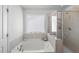 Bright bathroom with a large window and ample natural light at 80 Spotted Bee Way, Youngsville, NC 27596