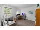 Bedroom featuring a window, plush carpeting, and setup as home office space at 80 Spotted Bee Way, Youngsville, NC 27596