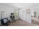 Bright bedroom featuring carpet floors, a closet, and a window with natural light at 80 Spotted Bee Way, Youngsville, NC 27596