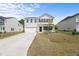 Classic two-story home with an attached two-car garage and a well-manicured lawn at 80 Spotted Bee Way, Youngsville, NC 27596