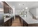Modern kitchen with granite counters, stainless appliances and open floor plan at 80 Spotted Bee Way, Youngsville, NC 27596