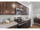 Updated kitchen with stainless steel appliances, and stylish cabinetry at 80 Spotted Bee Way, Youngsville, NC 27596