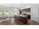 Eat in kitchen with stainless appliances, granite counters and abundant natural light at 80 Spotted Bee Way, Youngsville, NC 27596