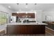 Spacious kitchen with stainless steel appliances and a large island at 80 Spotted Bee Way, Youngsville, NC 27596