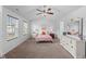 Bright main bedroom featuring vaulted ceilings, a ceiling fan, and neutral decor at 80 Spotted Bee Way, Youngsville, NC 27596