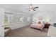 Spacious main bedroom with large windows that provide a lot of natural light at 80 Spotted Bee Way, Youngsville, NC 27596