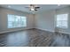 Bright, spacious bedroom with two large windows and wood-look floors at 800 Gathering Park Cir # 204, Cary, NC 27519