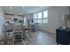 Bright, airy dining room features plenty of natural light, hardwood-style floors, and modern decor at 800 Gathering Park Cir # 204, Cary, NC 27519