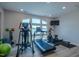 Home gym with exercise equipment and natural light from a large window at 800 Gathering Park Cir # 204, Cary, NC 27519