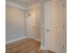 Neutral hallway features doors, modern trim, and durable floors at 800 Gathering Park Cir # 204, Cary, NC 27519