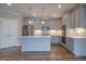 Modern kitchen with stainless steel appliances and a center island at 800 Gathering Park Cir # 204, Cary, NC 27519