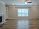 Bright living room with wood floors, recessed lighting, and large windows at 800 Gathering Park Cir # 204, Cary, NC 27519