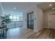 Bright lobby with an elevator, exit door, balcony, recessed lighting, and wood-look floors at 800 Gathering Park Cir # 204, Cary, NC 27519