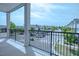Balcony view of community featuring a metal railing and view of the parking lot at 800 Gathering Park Cir # 204, Cary, NC 27519