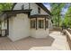 Back deck area with bay window feature on white painted brick home at 814 Ellynn Dr, Cary, NC 27511