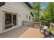 Spacious back deck with sliding glass doors offers a seamless transition to outdoor living and relaxation at 814 Ellynn Dr, Cary, NC 27511