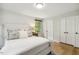 Bright bedroom with hardwood floors, comfortable bed, and ample closet space at 814 Ellynn Dr, Cary, NC 27511