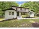 A picturesque view of the home's front facade and the surrounding lush greenery at 814 Ellynn Dr, Cary, NC 27511