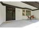Inviting front porch with stylish seating, a decorative wreath, and brick accents at 814 Ellynn Dr, Cary, NC 27511