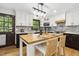 Open concept kitchen featuring a butcher block island, stainless steel appliances, and stone backsplash at 814 Ellynn Dr, Cary, NC 27511