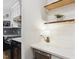 Contemporary kitchen showcasing open shelving, stainless steel appliances, and modern countertops at 814 Ellynn Dr, Cary, NC 27511