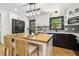 Modern kitchen featuring a butcher block island, stainless appliances, and stylish white and dark cabinets at 814 Ellynn Dr, Cary, NC 27511