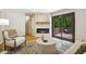 Cozy living room featuring a modern fireplace and sliding glass doors to the outside deck at 814 Ellynn Dr, Cary, NC 27511