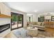 Open-concept room with fireplace and access to the deck, seamlessly connected to the dining and kitchen areas at 814 Ellynn Dr, Cary, NC 27511