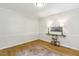Bright living room featuring hardwood floors and a decorative console table with lighting at 814 Ellynn Dr, Cary, NC 27511