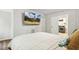 Comfortable bedroom with a large television and an open entryway to the laundry room at 814 Ellynn Dr, Cary, NC 27511