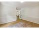 Office area with hardwood floors, wainscoting, and french doors, creating a bright and professional workspace at 814 Ellynn Dr, Cary, NC 27511