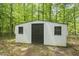 Durable storage shed with a secure door and windows, providing ample space for tools and equipment at 814 Ellynn Dr, Cary, NC 27511