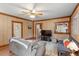 Comfortable living room featuring wood paneled walls, hardwood floors, furniture, and open view of front entrance at 820 Southern St, Selma, NC 27576