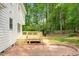 Backyard featuring a wooden deck, brick patio and beautiful landscaping at 8504 Boot Ct, Raleigh, NC 27615