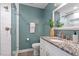 Stylish bathroom with granite countertop, walk-in shower, and modern fixtures at 8504 Boot Ct, Raleigh, NC 27615