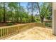 Inviting backyard deck with wood railing, perfect for outdoor entertaining and relaxation at 8504 Boot Ct, Raleigh, NC 27615