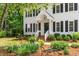 Charming two-story home with classic black shutters and a well-manicured front yard, offering inviting curb appeal at 8504 Boot Ct, Raleigh, NC 27615