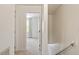 Bright hallway featuring carpet flooring with neutral walls leading to a bedroom at 8504 Boot Ct, Raleigh, NC 27615