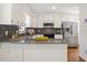 Modern kitchen featuring granite countertops, stainless steel appliances, and ample cabinet space at 8504 Boot Ct, Raleigh, NC 27615