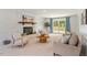 Spacious living room featuring a brick fireplace, cozy seating, and sliding doors leading to the outdoor deck at 8504 Boot Ct, Raleigh, NC 27615