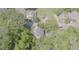 High aerial perspective showing a home surrounded by lush trees and neighboring properties in a residential area at 905 Carroll St, Durham, NC 27701