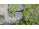 Overhead aerial view of a well-maintained home, showcasing its roof, yard, and surrounding green landscape at 905 Carroll St, Durham, NC 27701