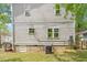 Exterior view of backyard featuring the home, a deck and string lights at 905 Carroll St, Durham, NC 27701