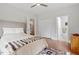 Well-lit bedroom with hardwood floors, a ceiling fan, and neutral decor at 905 Carroll St, Durham, NC 27701