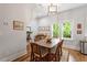 Inviting dining room featuring hardwood floors, natural light, and traditional decor at 905 Carroll St, Durham, NC 27701
