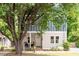 Charming two-story home with inviting front porch and curb appeal, nestled amidst lush greenery at 905 Carroll St, Durham, NC 27701