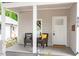 Charming front porch with two comfortable chairs, complemented by stylish decor and curb appeal at 905 Carroll St, Durham, NC 27701